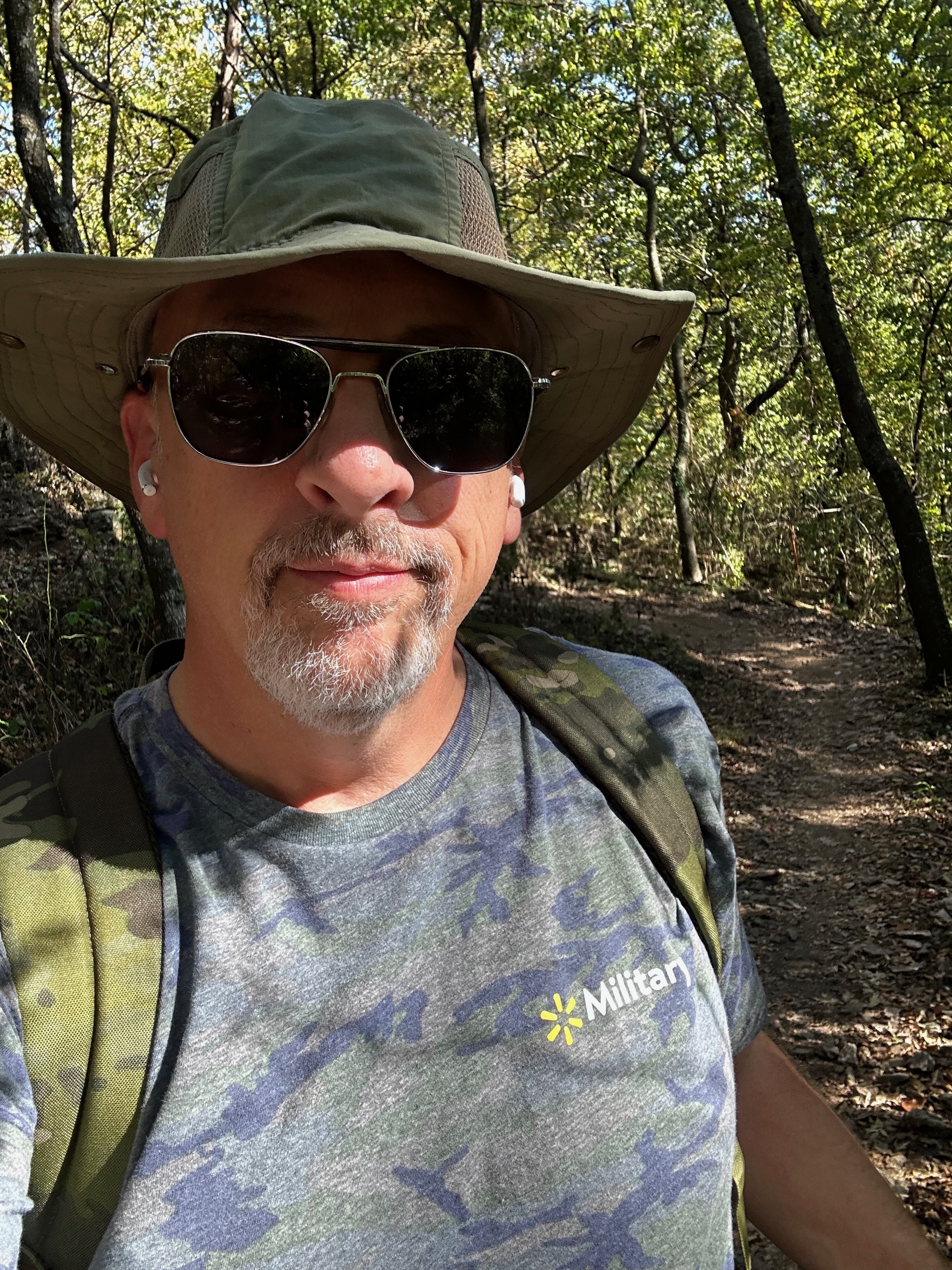 Scott outdoors on a wooded trail